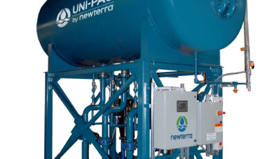 A Uni-pac by Newterra system consisting of a blue metal frame made of dimensional steel, with an electrical panel, pipes of various sizes connected to an elevated horizontal tank with components and valves on the pipes and tank.