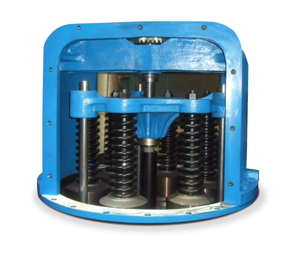 View of a multiport relief valve with access panel removed, interior consists of a blue cast metal piece supported by various metal rods, some with springs bolted to the cast metal piece, a threaded rod runs through the center of unit