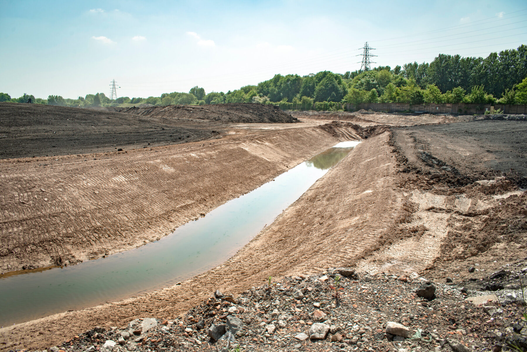 A stream of uncleaned water flows in a remediation site prior to being cleaned