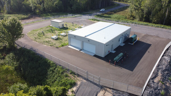 Aerial image of a steel sided building with white automatic doors