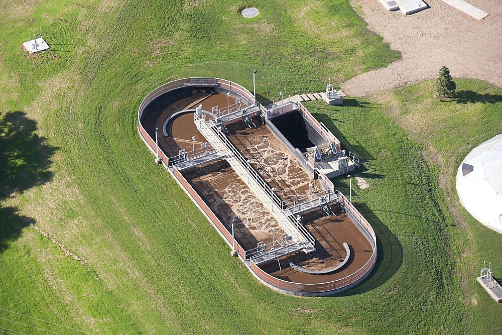 wide aerial shot of a tri-oval oxidation ditch