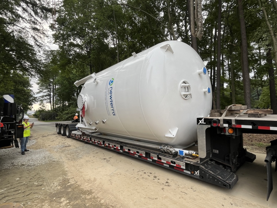 A newterra vessel on its side atop a trailer